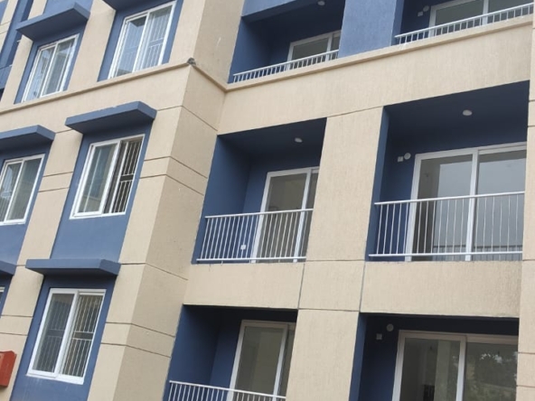 East-facing 1BHK flat for sale in Mogappair West, 682 sqft in a gated community with lift and car parking.