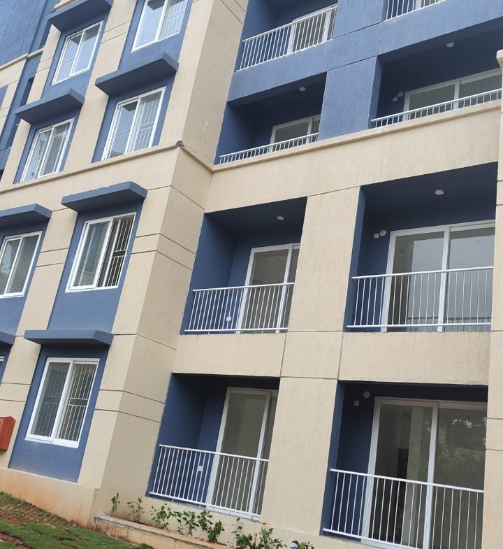 East-facing 1BHK flat for sale in Mogappair West, 682 sqft in a gated community with lift and car parking.